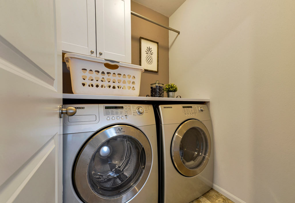 Tension rods help you utilize small spaces in your laundry room